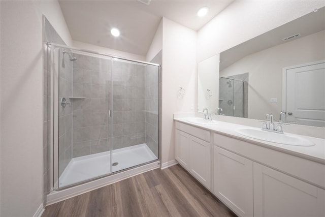 1850 Settlers Glen Dr Unit 904, Round Rock, TX 78665 - full bath with visible vents, a sink, a stall shower, and wood finished floors