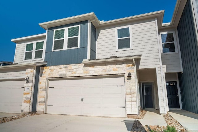 1850 Settlers Glen Dr Unit 904, Round Rock, TX 78665 - view of property with an attached garage, stone siding, and concrete driveway