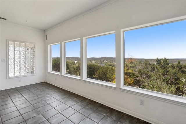 403 Rogart Dr, Spicewood, TX 78669 - unfurnished sunroom featuring tile patterned flooring, plenty of natural light, and ornamental molding