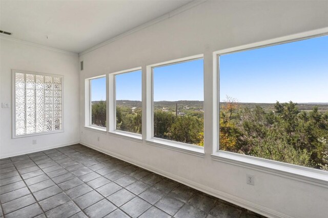 403 Rogart Dr, Spicewood, TX 78669 - unfurnished sunroom with tile patterned floors, healthy amount of natural light, and ornamental molding