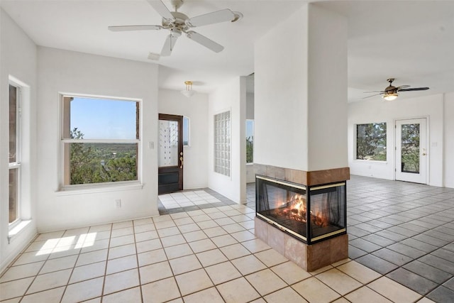 403 Rogart Dr, Spicewood, TX 78669 - foyer with a ceiling fan, light tile patterned floors, and a wealth of natural light