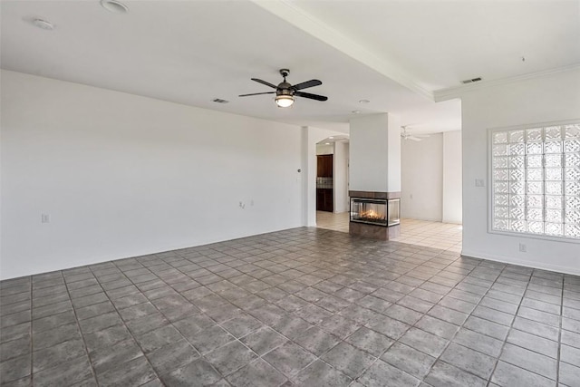 403 Rogart Dr, Spicewood, TX 78669 - unfurnished living room featuring ceiling fan, a multi sided fireplace, and visible vents
