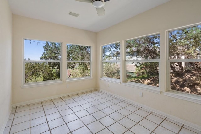 403 Rogart Dr, Spicewood, TX 78669 - unfurnished sunroom featuring tile patterned floors, visible vents, and baseboards