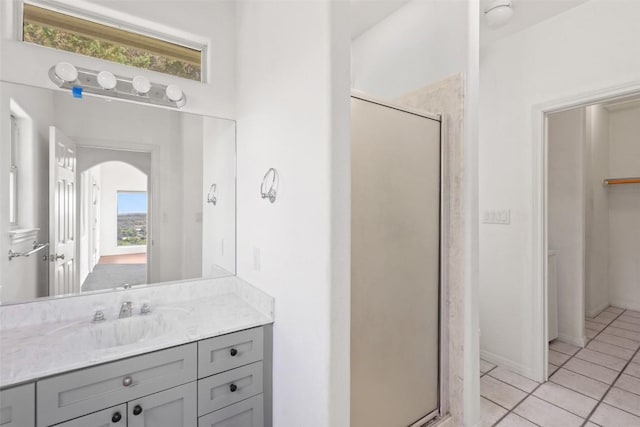 403 Rogart Dr, Spicewood, TX 78669 - full bathroom featuring tile patterned floors, vanity, and a shower stall