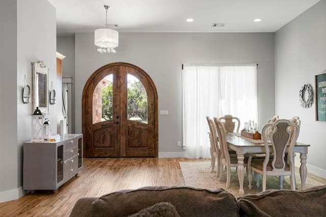 617 Chama Trce, Dripping Springs, TX 78620 - entrance foyer with light wood-style floors, a chandelier, and baseboards