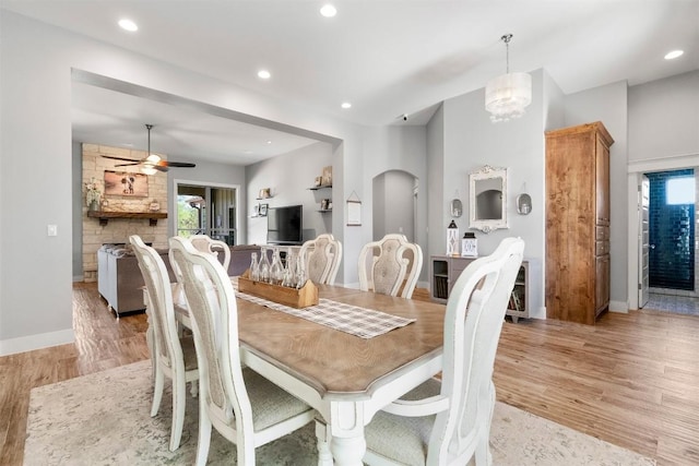 617 Chama Trce, Dripping Springs, TX 78620 - dining space with light wood-style floors, baseboards, arched walkways, ceiling fan, and recessed lighting