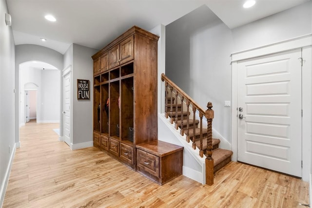 617 Chama Trce, Dripping Springs, TX 78620 - mudroom featuring arched walkways, light wood-type flooring, recessed lighting, and baseboards