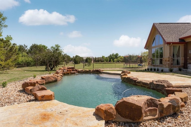 617 Chama Trce, Dripping Springs, TX 78620 - outdoor pool with a trampoline and a yard
