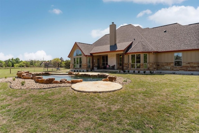 617 Chama Trce, Dripping Springs, TX 78620 - rear view of property with a chimney, a patio, a yard, and stone siding
