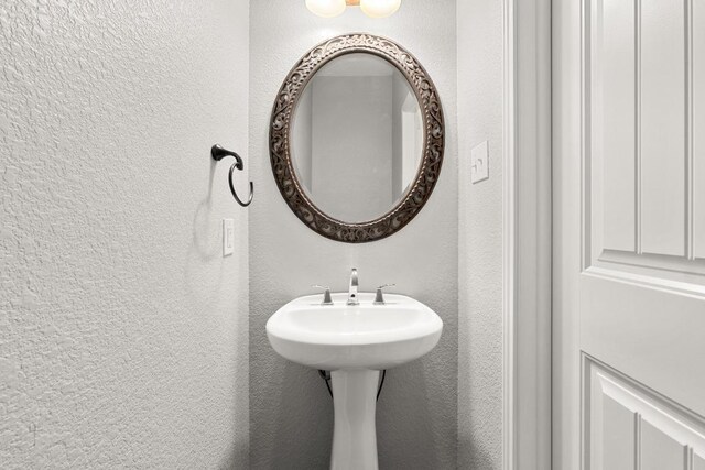 bathroom with a textured wall