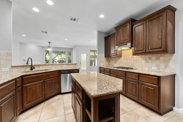 kitchen featuring open shelves, a sink, stainless steel appliances, tasteful backsplash, and under cabinet range hood