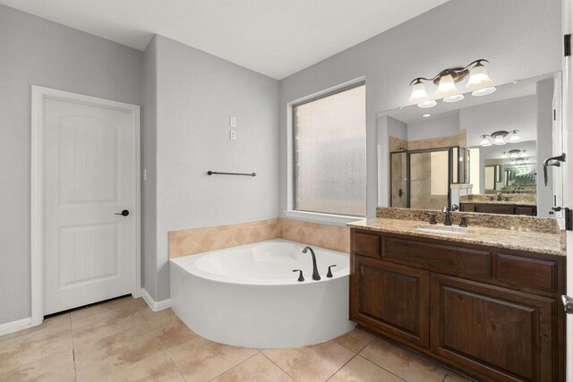full bath with tile patterned floors, a shower stall, a bath, and vanity