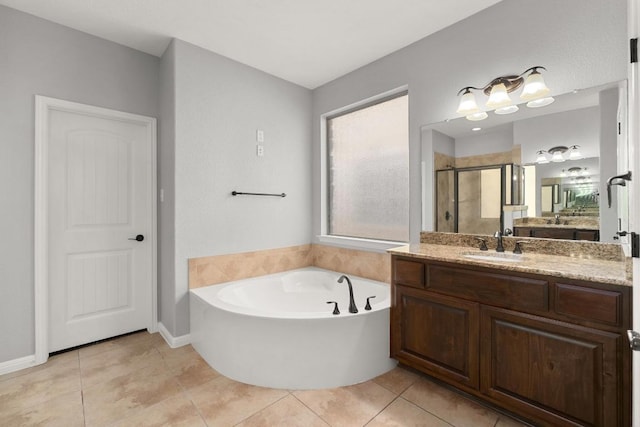 4014 Remington Rd, Cedar Park, TX 78613 - full bath featuring a stall shower, vanity, a bath, tile patterned floors, and baseboards