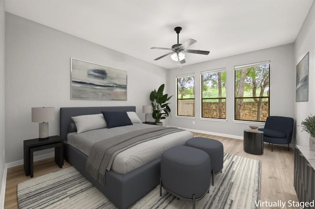 4014 Remington Rd, Cedar Park, TX 78613 - bedroom featuring light wood-style floors, baseboards, and a ceiling fan