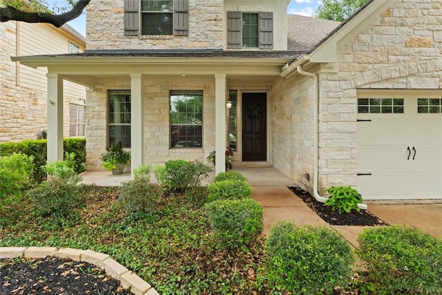 4014 Remington Rd, Cedar Park, TX 78613 - entrance to property featuring stone siding, an attached garage, a porch, and roof with shingles