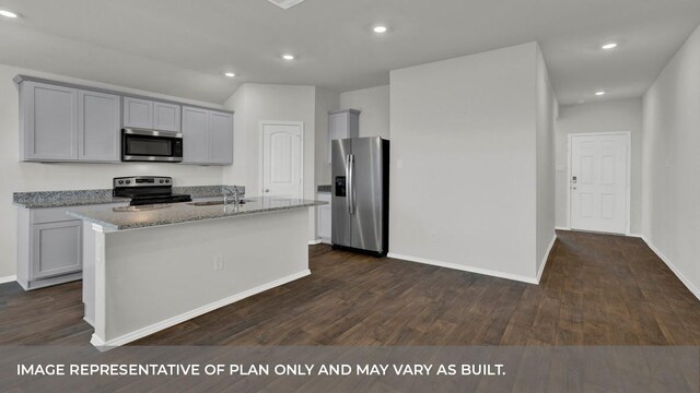 kitchen featuring light stone countertops, gray cabinets, baseboards, and appliances with stainless steel finishes