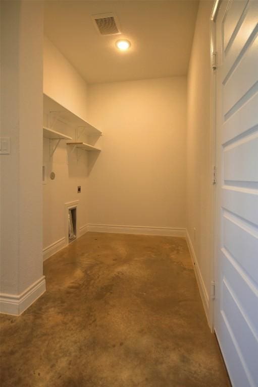 283 Calle Cortez Dr, Buchanan Dam, TX 78609 - laundry room featuring electric dryer hookup, visible vents, laundry area, and baseboards