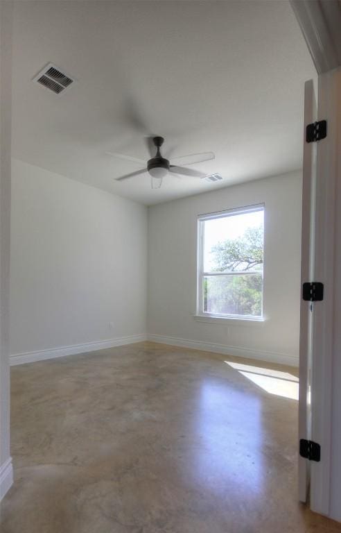 283 Calle Cortez Dr, Buchanan Dam, TX 78609 - empty room with visible vents, baseboards, a ceiling fan, and finished concrete flooring