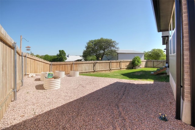 283 Calle Cortez Dr, Buchanan Dam, TX 78609 - view of yard featuring a fenced backyard and a patio area