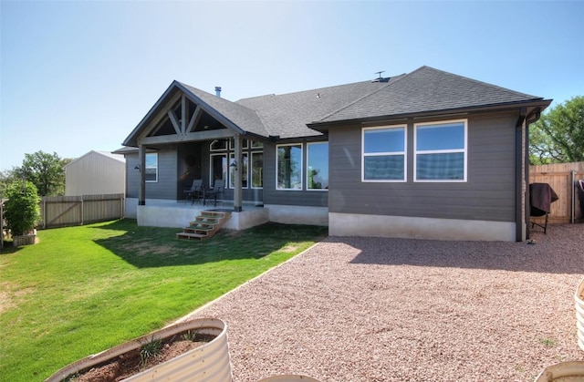 283 Calle Cortez Dr, Buchanan Dam, TX 78609 - rear view of house with a shingled roof, a yard, a patio area, and fence