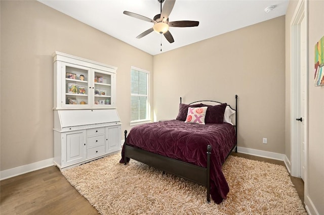 607 Flint Ridge Trl, Georgetown, TX 78628 - bedroom with wood finished floors, ceiling fan, and baseboards