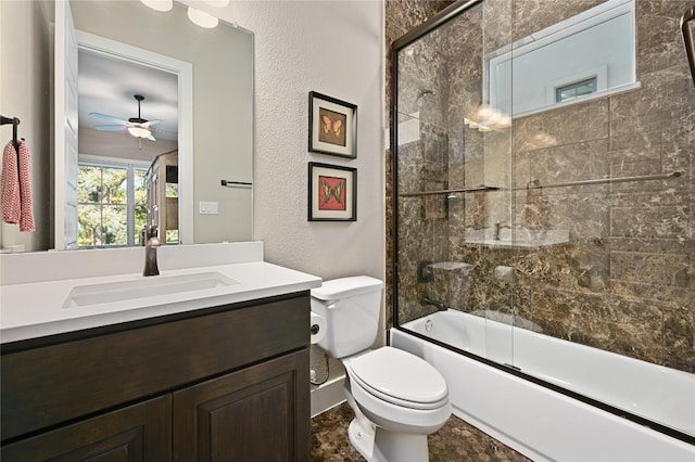 607 Flint Ridge Trl, Georgetown, TX 78628 - full bath featuring shower / bath combination with glass door, vanity, a ceiling fan, toilet, and a textured wall
