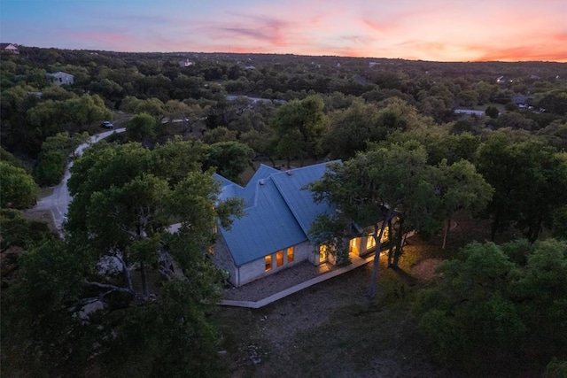 aerial view at dusk of a wooded view