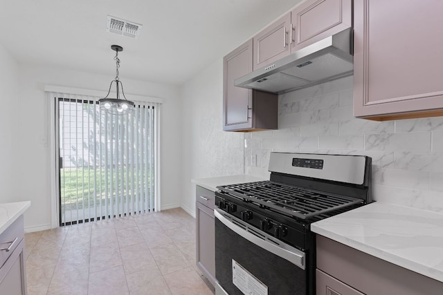 11500 Ruffed Grouse Dr, Austin, TX 78758 - kitchen with gas stove, under cabinet range hood, decorative backsplash, hanging light fixtures, and light stone counters