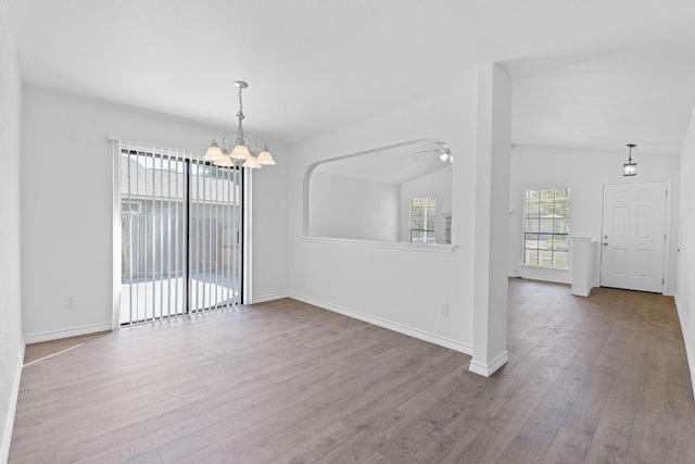 11500 Ruffed Grouse Dr, Austin, TX 78758 - unfurnished room with wood finished floors, a chandelier, baseboards, ceiling fan, and lofted ceiling