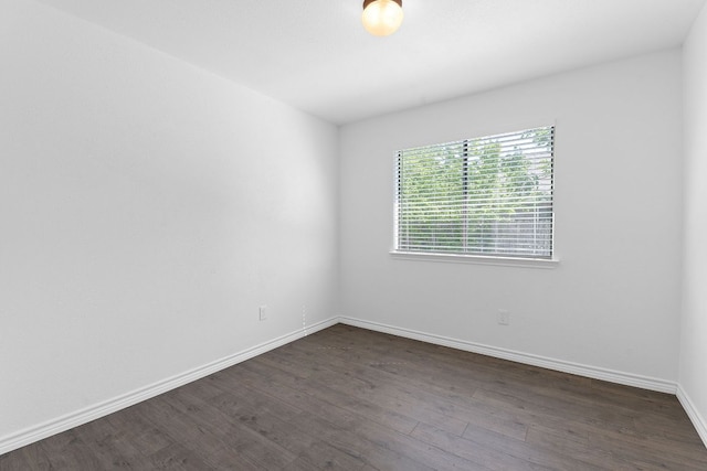 11500 Ruffed Grouse Dr, Austin, TX 78758 - unfurnished room featuring dark wood-style floors and baseboards