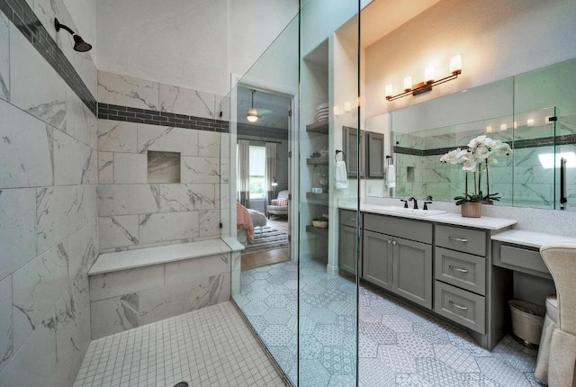 full bath with tile patterned flooring, vanity, tile walls, and walk in shower