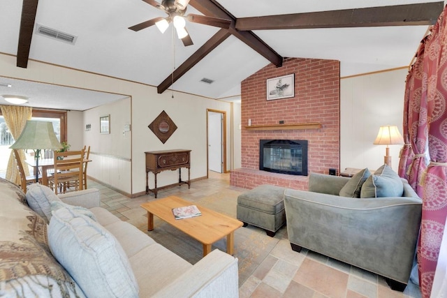 2600 Donna Dr, Taylor, TX 76574 - living area featuring ceiling fan, a fireplace, and baseboards