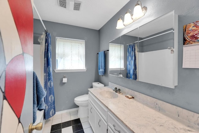 2600 Donna Dr, Taylor, TX 76574 - bathroom featuring vanity, toilet, curtained shower, and baseboards