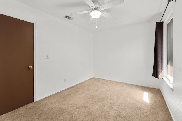 21459 Coyote Trl Unit B4, Lago Vista, TX 78645 - carpeted spare room featuring a ceiling fan and baseboards