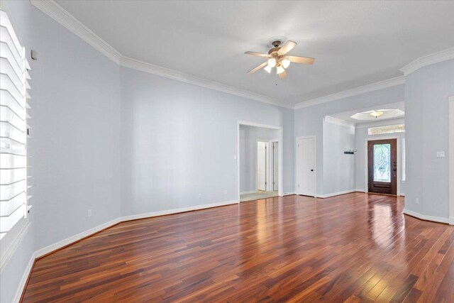 8312 Jancy Dr, Austin, TX 78750 - spare room featuring a ceiling fan, wood finished floors, and crown molding