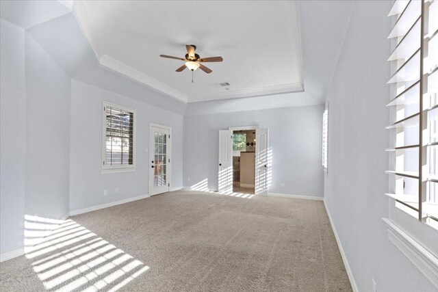 8312 Jancy Dr, Austin, TX 78750 - empty room with a raised ceiling, ceiling fan, crown molding, and carpet floors