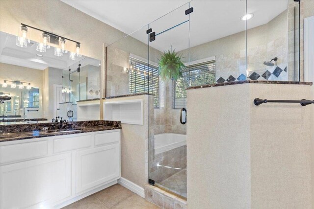 8312 Jancy Dr, Austin, TX 78750 - bathroom with a stall shower, vanity, tile patterned flooring, and a bath