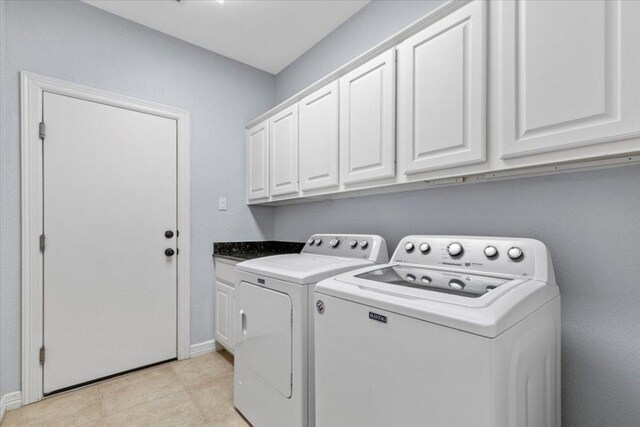 8312 Jancy Dr, Austin, TX 78750 - laundry room with washing machine and dryer and cabinet space