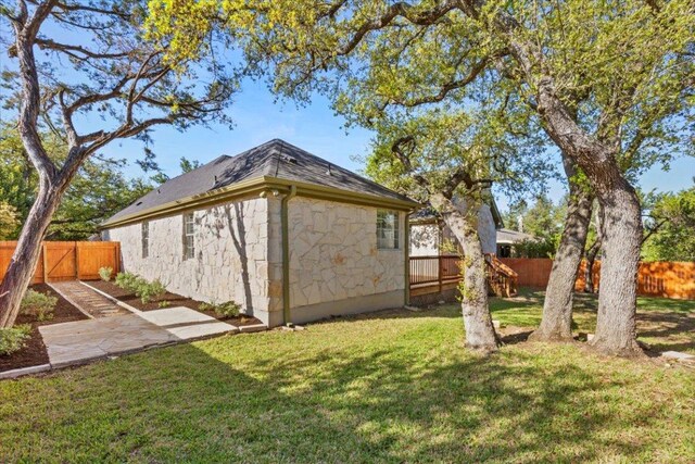 8312 Jancy Dr, Austin, TX 78750 - view of property exterior featuring a fenced backyard and stone siding