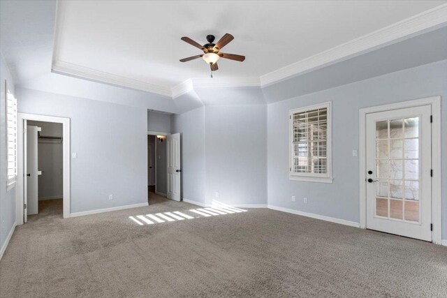 8312 Jancy Dr, Austin, TX 78750 - unfurnished bedroom with crown molding, carpet floors, a ceiling fan, and a spacious closet