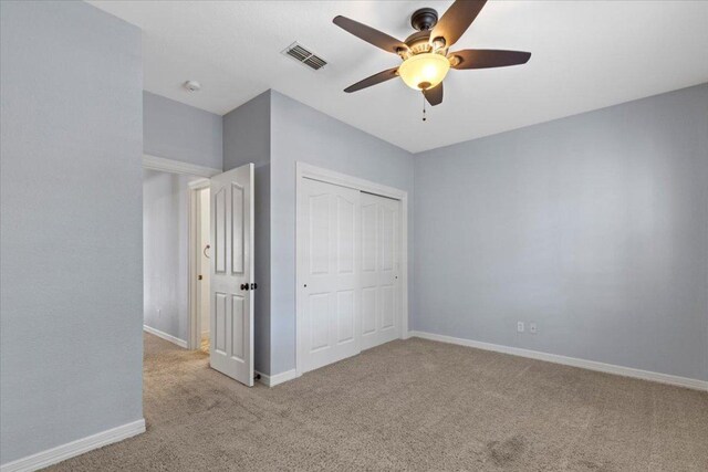 8312 Jancy Dr, Austin, TX 78750 - unfurnished bedroom with light colored carpet, a closet, and ceiling fan