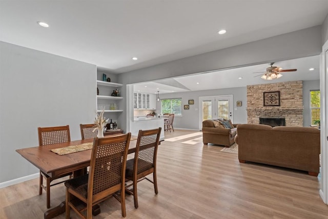 11605 Gunsmoke Cir, Austin, TX 78750 - dining space with light wood-type flooring, healthy amount of natural light, a ceiling fan, baseboards, and recessed lighting