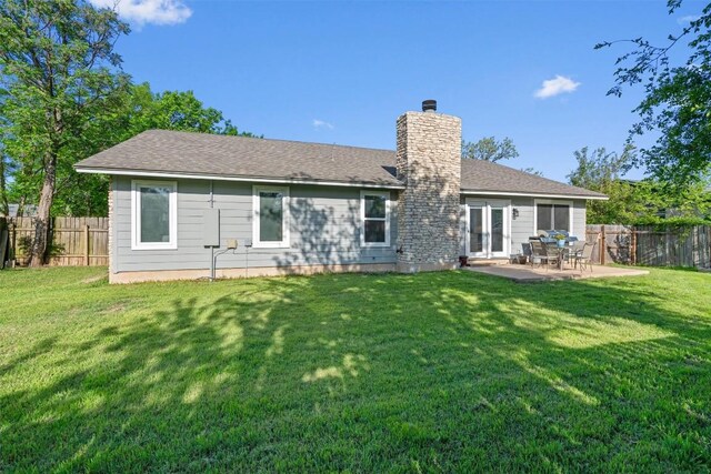 11605 Gunsmoke Cir, Austin, TX 78750 - back of property with a chimney, a patio, and roof with shingles
