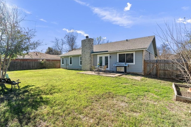 11605 Gunsmoke Cir, Austin, TX 78750 - rear view of property with a chimney, a patio area, and a shingled roof