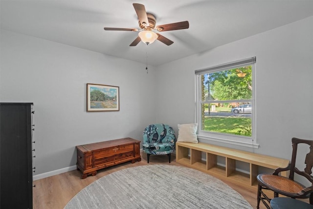 11605 Gunsmoke Cir, Austin, TX 78750 - sitting room featuring a ceiling fan, light wood-style floors, and baseboards
