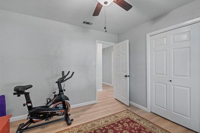 11605 Gunsmoke Cir, Austin, TX 78750 - workout area featuring ceiling fan, light wood-style floors, and baseboards
