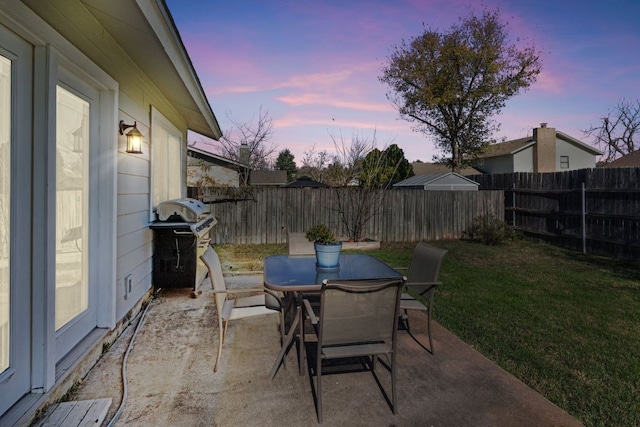 11605 Gunsmoke Cir, Austin, TX 78750 - patio terrace at dusk featuring grilling area and outdoor dining space