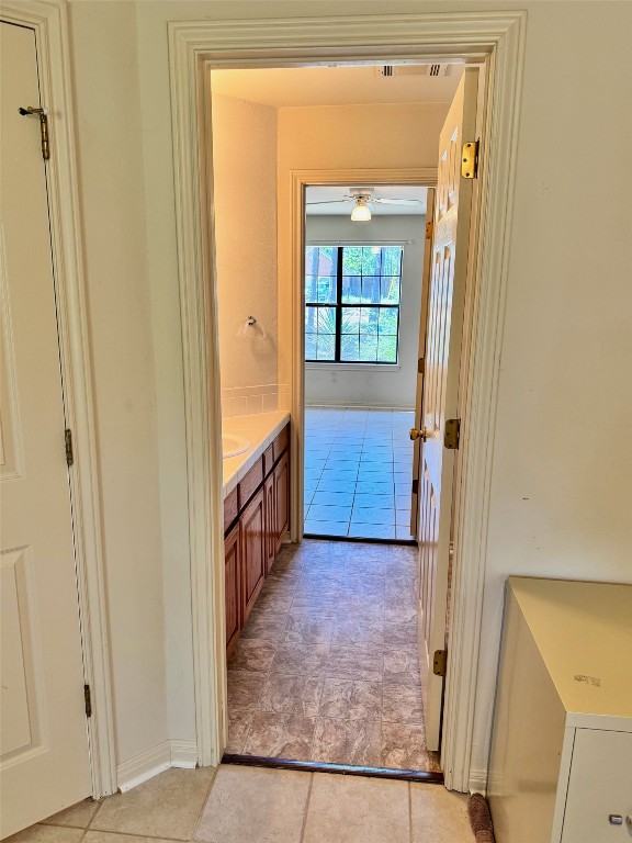 bathroom with ceiling fan