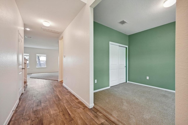 234 Coleto Creek Loop, Kyle, TX 78640 - hall featuring baseboards and wood finished floors