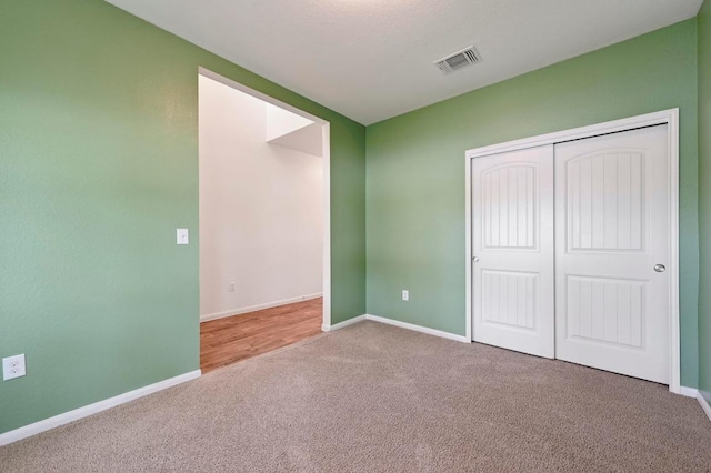 234 Coleto Creek Loop, Kyle, TX 78640 - unfurnished bedroom with carpet, baseboards, and a closet
